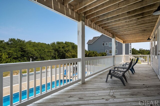 deck with an outdoor pool