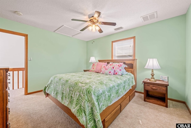 227 Outrigger Dr Lot 132, Kill Devil Hills, NC 27948 - bedroom with visible vents, attic access, carpet floors, and a textured ceiling