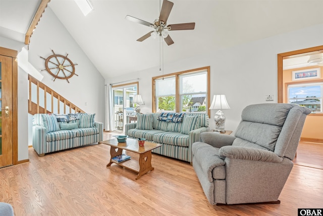 227 Outrigger Dr Lot 132, Kill Devil Hills, NC 27948 - living room featuring high vaulted ceiling, ceiling fan, light wood-style floors, and stairway