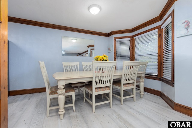 718 Canal Dr Lot 308, Kill Devil Hills, NC 27948 - dining room featuring crown molding, baseboards, and wood finished floors