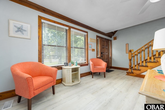 718 Canal Dr Lot 308, Kill Devil Hills, NC 27948 - living area with baseboards, wood finished floors, crown molding, stairway, and ceiling fan
