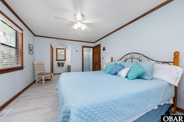 718 Canal Dr Lot 308, Kill Devil Hills, NC 27948 - bedroom featuring baseboards, light wood-style flooring, ornamental molding, arched walkways, and ceiling fan