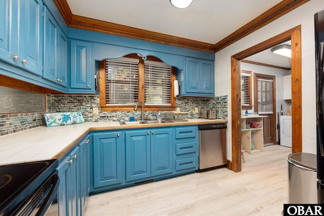 718 Canal Dr Lot 308, Kill Devil Hills, NC 27948 - kitchen with stainless steel dishwasher, ornamental molding, washer / clothes dryer, a sink, and blue cabinets