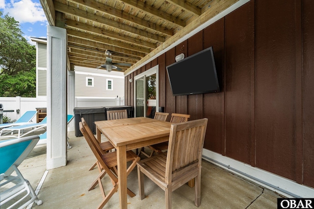 view of patio / terrace with ceiling fan, fence, and outdoor dining area