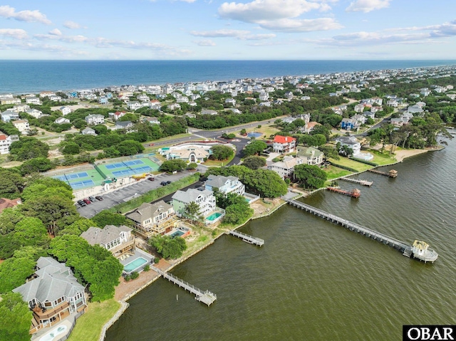 aerial view of property and surrounding area with a large body of water