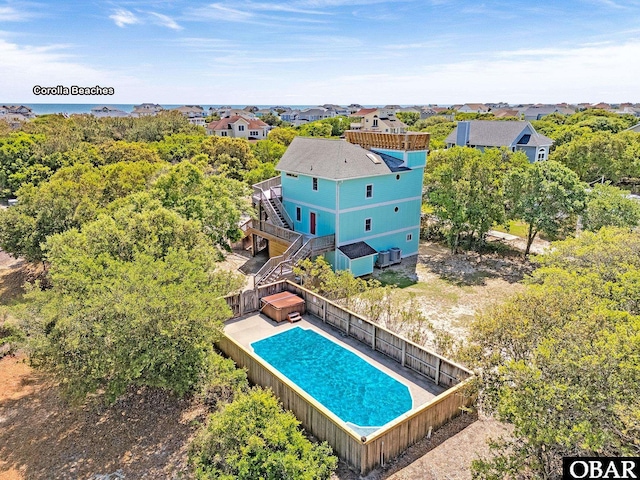 view of pool with a fenced backyard