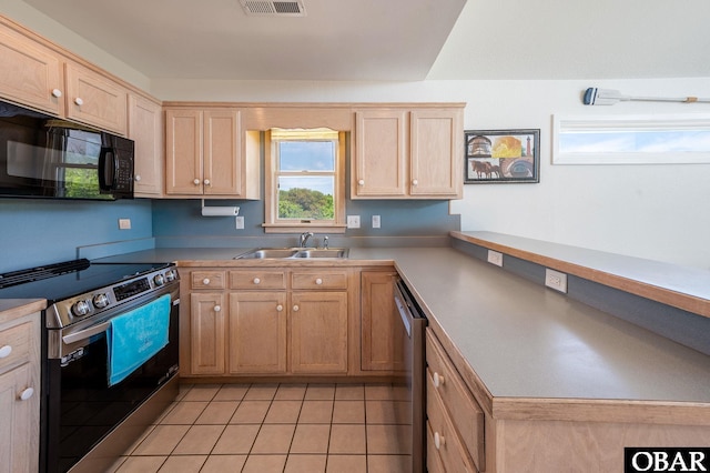 kitchen featuring light brown cabinetry, light tile patterned flooring, a sink, stainless steel appliances, and a peninsula