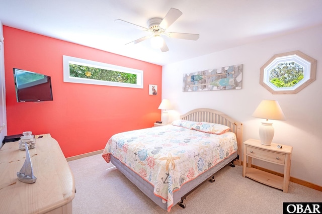 bedroom featuring carpet floors, baseboards, and ceiling fan