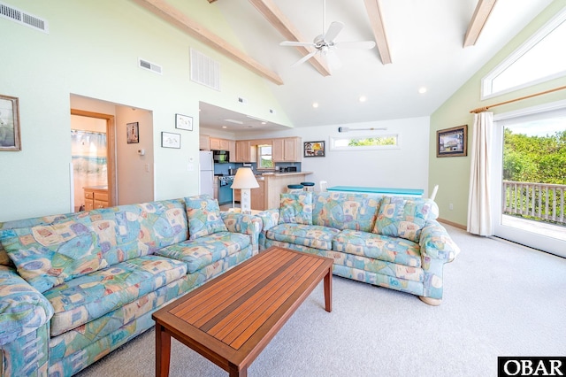 living room featuring high vaulted ceiling, visible vents, and beam ceiling