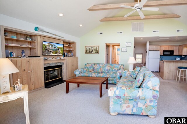 living area featuring visible vents, light carpet, and beam ceiling