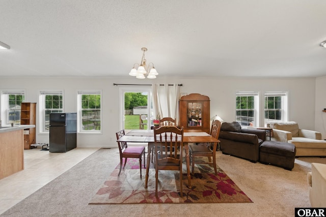 138 Swains Ln Lot 3, Barco, NC 27917 - dining area with a chandelier, light colored carpet, and light tile patterned floors