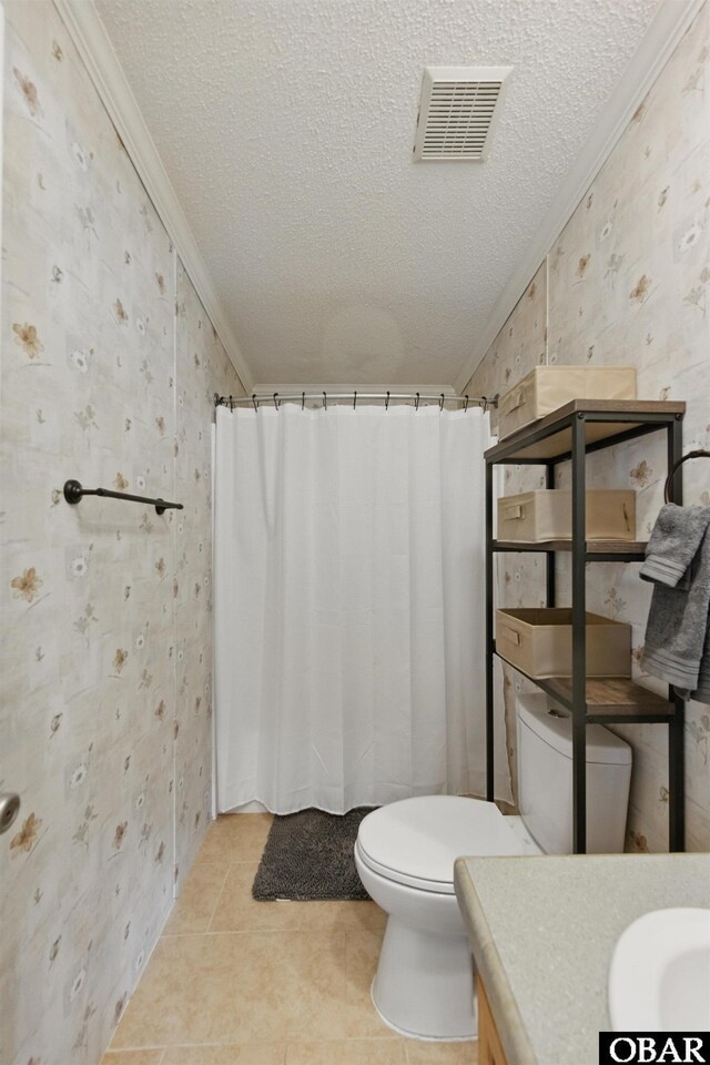 138 Swains Ln Lot 3, Barco, NC 27917 - bathroom featuring wallpapered walls, ornamental molding, toilet, vanity, and a textured ceiling