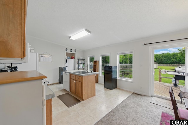 138 Swains Ln Lot 3, Barco, NC 27917 - kitchen featuring freestanding refrigerator, a sink, dishwasher, a center island with sink, and light tile patterned flooring