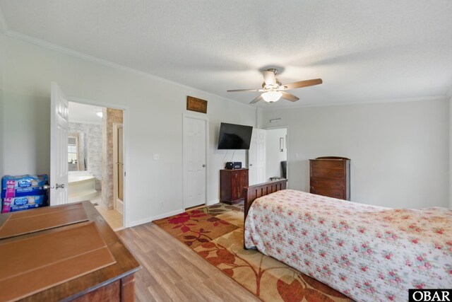 138 Swains Ln Lot 3, Barco, NC 27917 - bedroom with crown molding, light wood-type flooring, baseboards, a textured ceiling, and ensuite bathroom