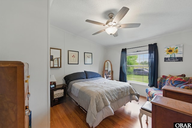 138 Swains Ln Lot 3, Barco, NC 27917 - bedroom with crown molding, wood finished floors, lofted ceiling, a textured ceiling, and a ceiling fan