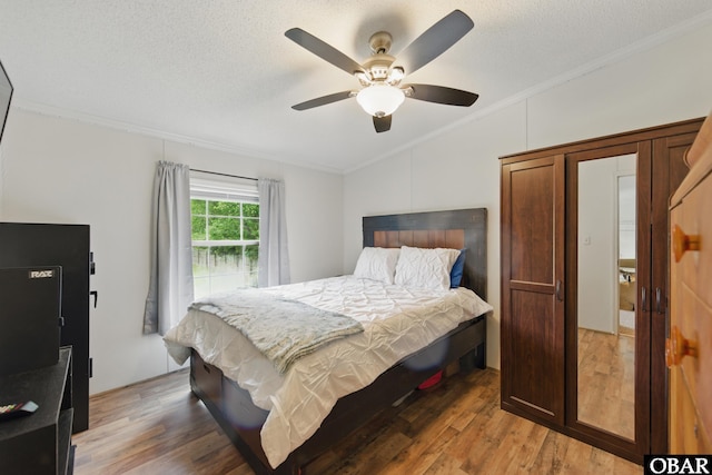 138 Swains Ln Lot 3, Barco, NC 27917 - bedroom with lofted ceiling, ornamental molding, light wood-style flooring, ceiling fan, and a textured ceiling