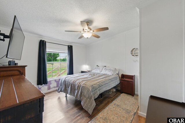 138 Swains Ln Lot 3, Barco, NC 27917 - bedroom featuring wood finished floors, a textured ceiling, baseboards, and a ceiling fan
