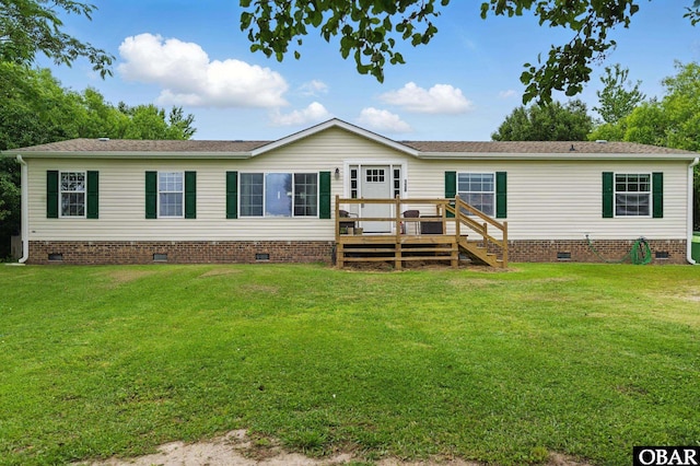 138 Swains Ln Lot 3, Barco, NC 27917 - rear view of property featuring crawl space, a deck, a lawn, and roof with shingles