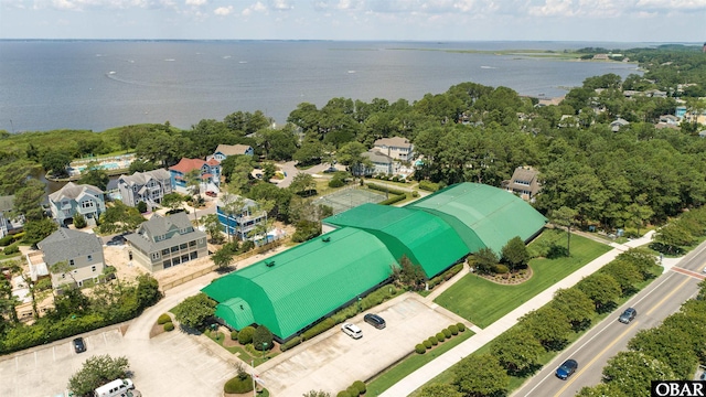 birds eye view of property featuring a water view and a residential view