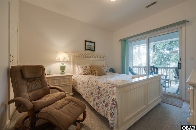 bedroom featuring access to exterior, visible vents, and carpet flooring