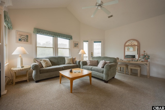 carpeted living room featuring high vaulted ceiling, visible vents, and a ceiling fan