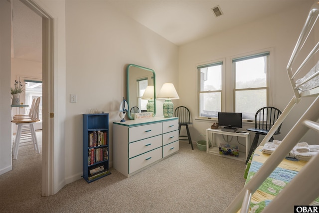 carpeted bedroom with visible vents and baseboards