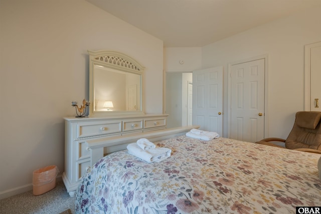 bedroom with carpet flooring and baseboards