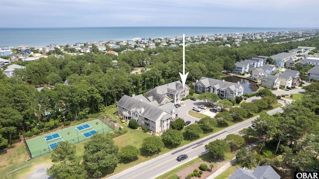 bird's eye view featuring a water view and a residential view