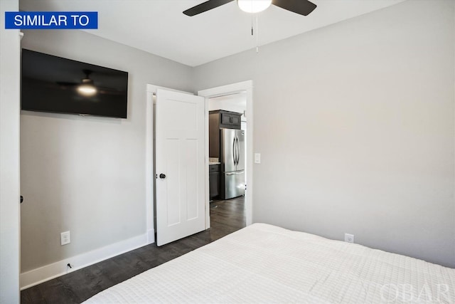 bedroom featuring ceiling fan, dark wood-style flooring, freestanding refrigerator, and baseboards