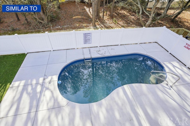 view of pool with a fenced in pool, fence private yard, and a patio