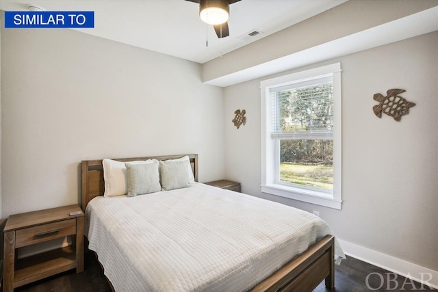 bedroom featuring a ceiling fan, dark wood-style flooring, visible vents, and baseboards