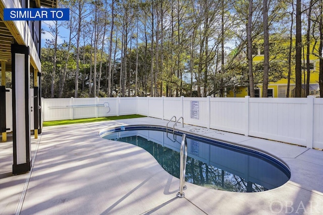 view of swimming pool with a fenced in pool, a patio area, and a fenced backyard