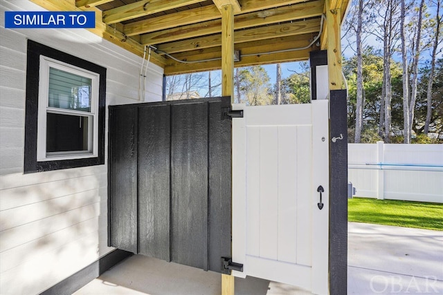 doorway to property with fence