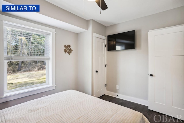 bedroom featuring ceiling fan, baseboards, and dark wood-type flooring