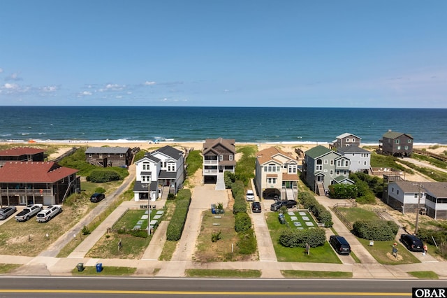 bird's eye view featuring a water view and a residential view