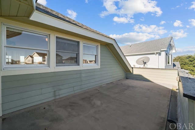 view of side of home with a patio area