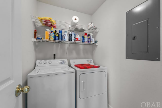 laundry area featuring laundry area, electric panel, and washer and dryer