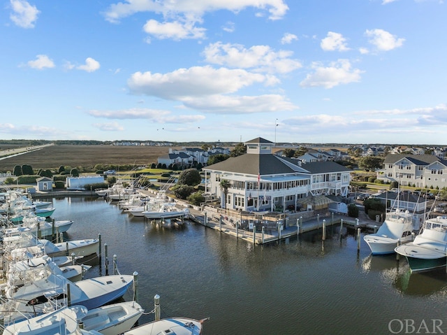 exterior space featuring a boat dock and a residential view