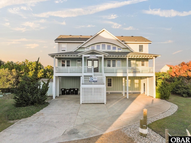 27206 Sea Chest Ct Lot 27, Salvo, NC 27972 - coastal home with driveway, a carport, board and batten siding, and roof with shingles