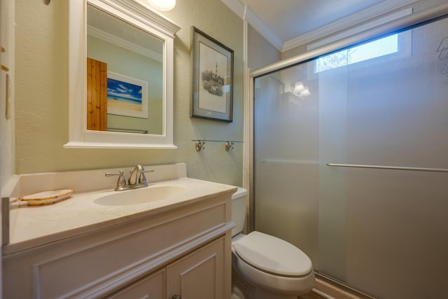 full bath with a textured wall, toilet, vanity, a stall shower, and crown molding