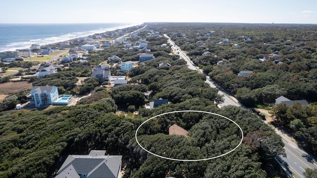 bird's eye view featuring a water view and a residential view