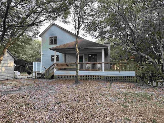 view of front of house featuring a wooden deck