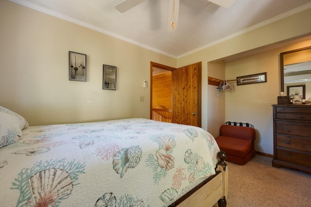 carpeted bedroom featuring ornamental molding and ceiling fan