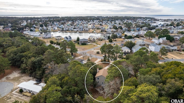 bird's eye view featuring a water view and a residential view