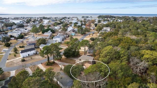 birds eye view of property with a residential view and a water view