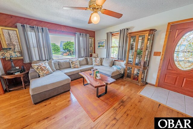 40191 Kiddy Ln Lot 13, Avon, NC 27915 - living area featuring a textured ceiling, ceiling fan, and light wood finished floors