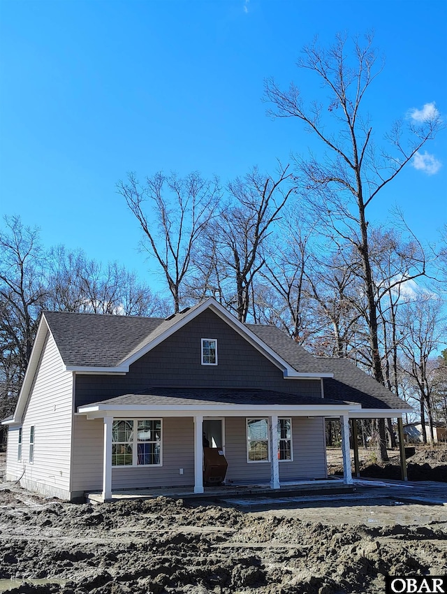 view of front of home featuring a porch and a shingled roof