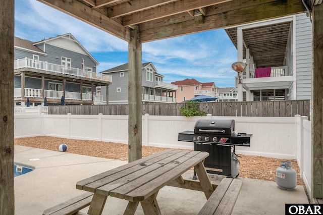 655 Pampas Ct Lot 162, Corolla, NC 27927 - fenced backyard featuring grilling area, a patio, and a residential view