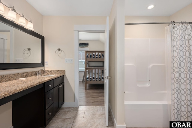 655 Pampas Ct Lot 162, Corolla, NC 27927 - bathroom featuring vanity, stone tile floors, shower / tub combo, and recessed lighting