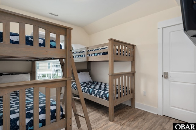655 Pampas Ct Lot 162, Corolla, NC 27927 - bedroom featuring wood finished floors and vaulted ceiling